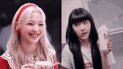 two girls are sitting next to each other and one of them is holding a cup of coffee .