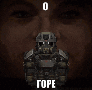a soldier with a gas mask is standing in front of a man 's face .