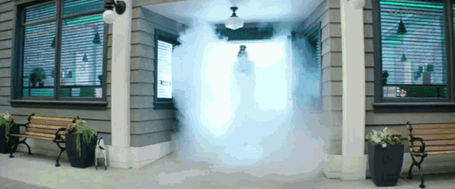 a building with a smoke coming out of the doorway