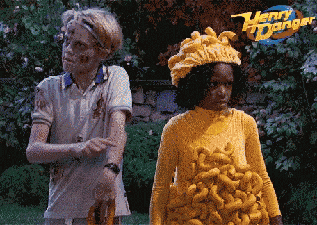 a boy and a girl are standing next to each other with a henry danger logo in the background