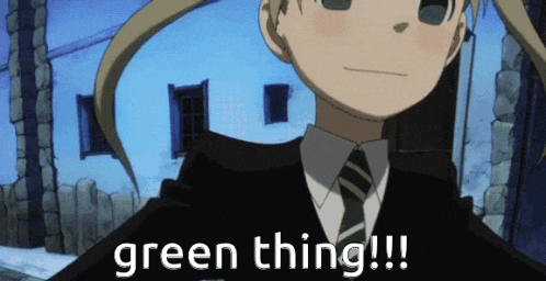 a girl in a suit and tie with the words green thing written below her