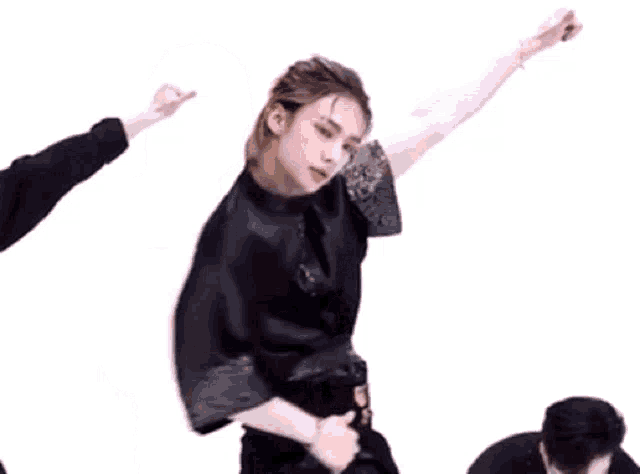 a group of young men are dancing in a room .