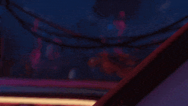 a girl with purple hair and glasses waves her hand