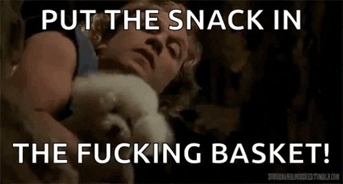 a man is laying down with a small white dog and the words put the snack in the fucking basket
