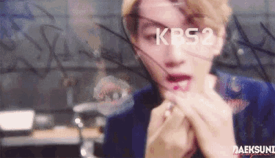 a close up of a person 's face with the word kps2 on the bottom