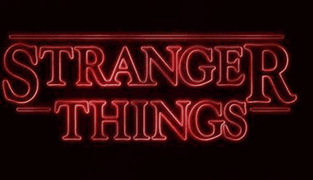 a neon sign that says `` stranger things '' is glowing in the dark .