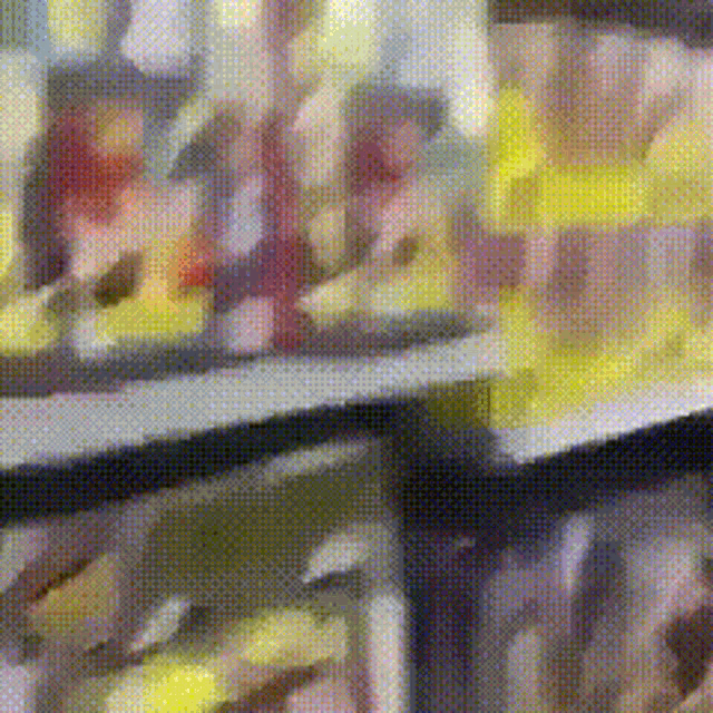 a close up of a painting with a blurred background
