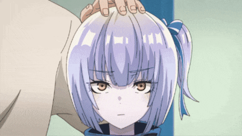 a person is putting their hand on the head of a girl