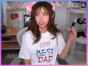 a woman wearing headphones and a white shirt that says best dad