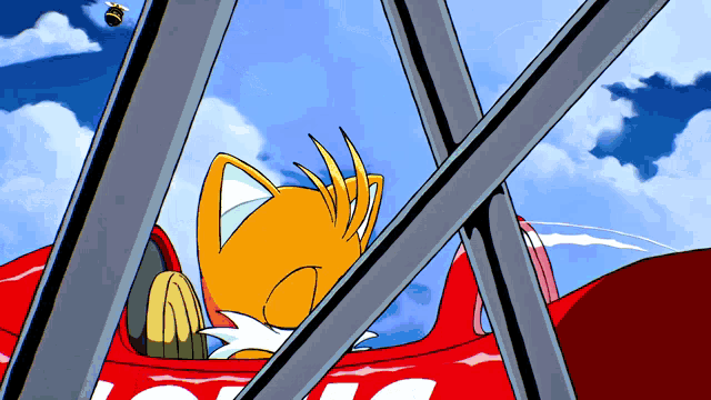 a cartoon of tails driving a red car with the letter g on the side