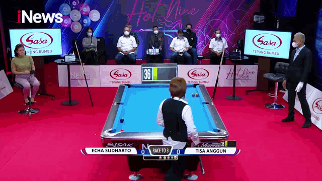 a pool table with a sign that says ' hot nine ' on it