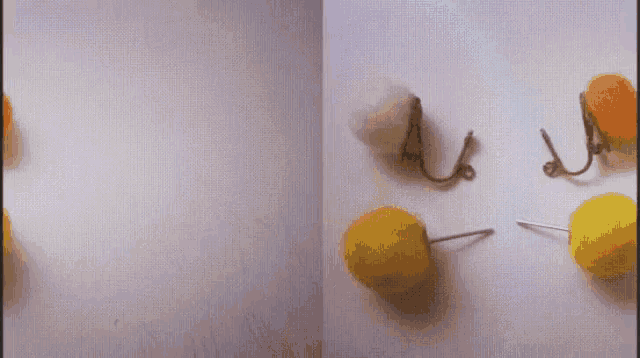 a yellow pin is stuck to a white object