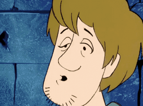 a close up of a cartoon character with a beard making a funny face