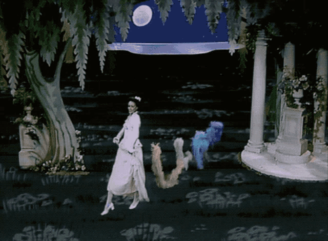a woman in a white dress is dancing in front of a tree with a full moon in the background