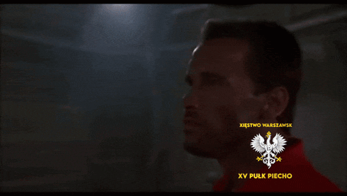 a man is wearing a red shirt that says xvi pulk piechoty