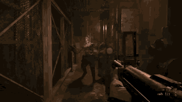 a person is playing a video game and they are aiming at a zombie with a gun