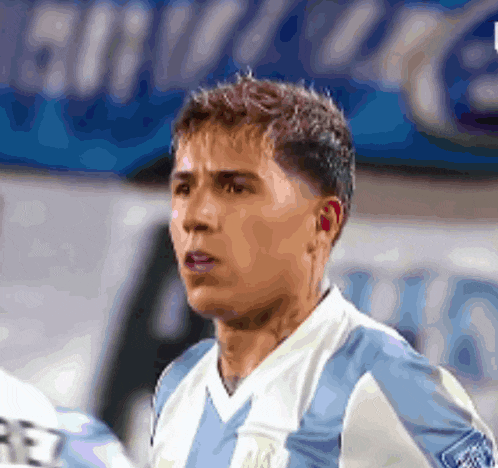 a soccer player in a blue and white jersey with the letter r on the front