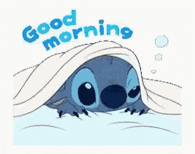 a sticker of stitch laying under a blanket with the words `` good morning '' .