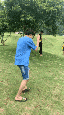 a man wearing flip flops with the letter c on the side