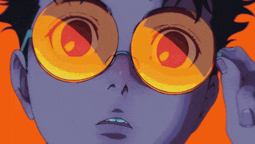 a close up of a person wearing a pair of yellow glasses