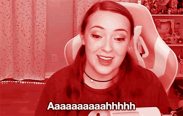 a woman in a pink and white chair says aa aa aahhh