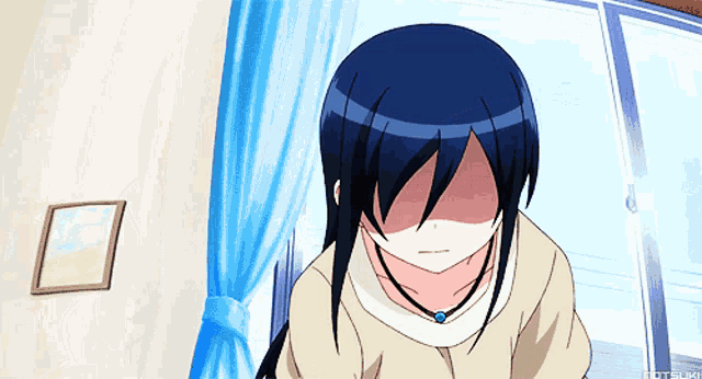 a girl with blue hair is making a funny face in front of a window