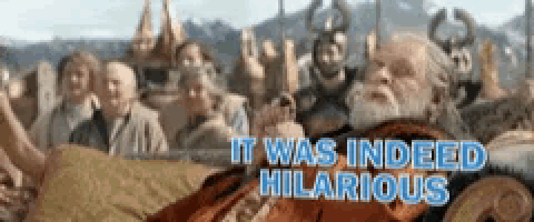 a man with a beard is laying on a couch with the words " it was indeed hilarious " on the bottom