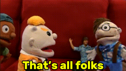 a group of stuffed animals are standing in front of a red wall with the words that 's all folks in yellow letters