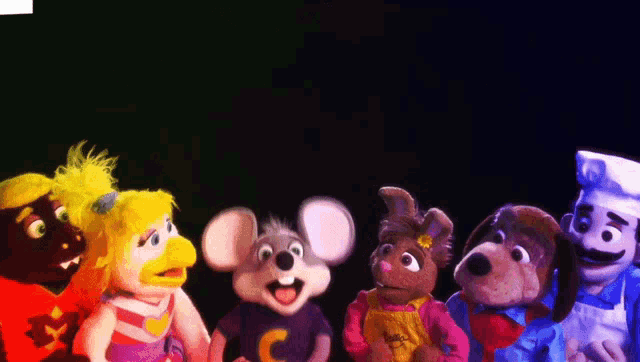a group of stuffed animals including a mouse and a dog