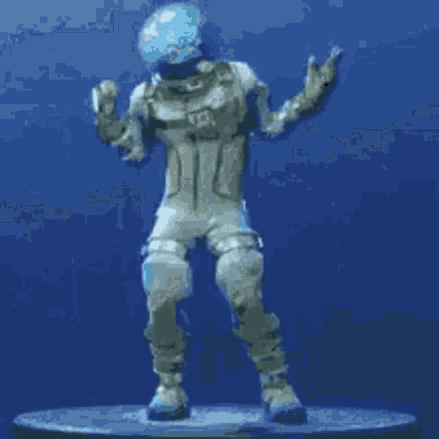 a statue of a man in a space suit is dancing on a blue background .