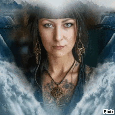 a woman wearing a necklace and earrings is surrounded by water