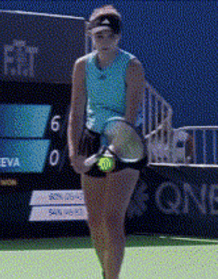 a woman is holding a tennis racquet in front of a scoreboard that says eva on it