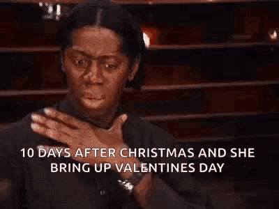 a woman is covering her mouth with her hands and says `` 10 days after christmas and she bring up valentines day ''