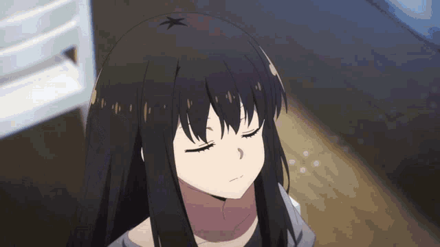 a girl with black hair has a star on her head