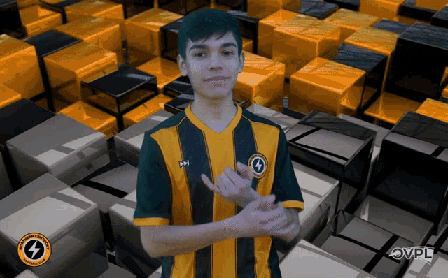 a young man wearing a yellow and black striped shirt with a lightning bolt on it