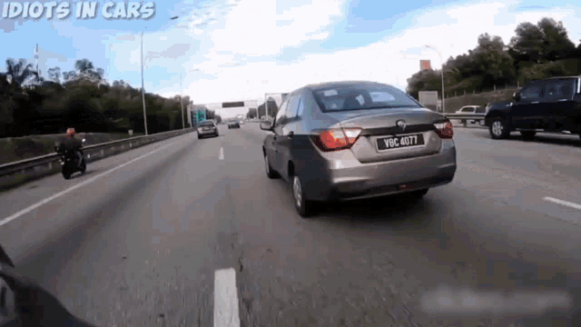a gray car with a license plate that says vbc 4071