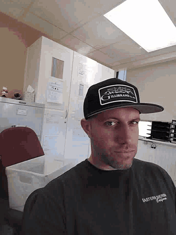 a man wearing a black hat that says thunderbolt on it