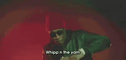 a man is standing in front of a red background with the words whipp n the yam on it .