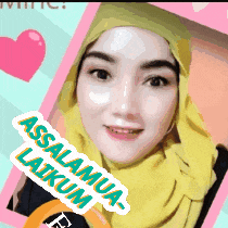 a woman wearing a yellow scarf with the words assalamua laikum written on it