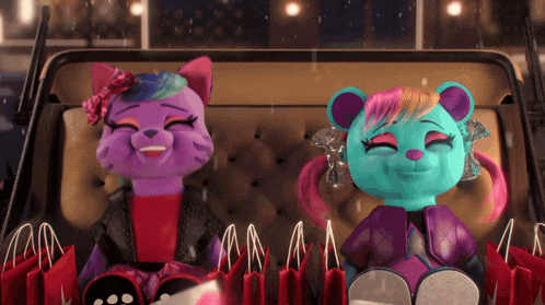 a purple cat and a blue bear are sitting next to each other