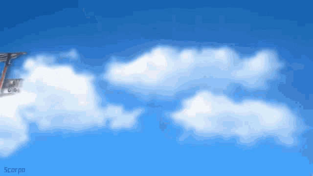 a blue sky with white clouds and the word scorpio on the bottom left