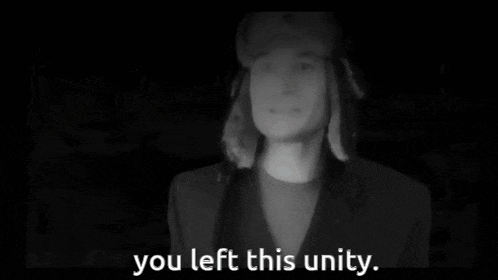 a man in a hat says you left this unity in a black and white photo