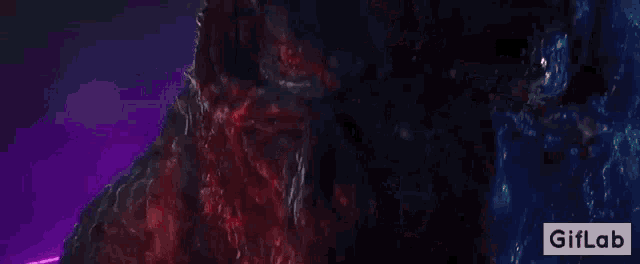 a close up of a monster 's face with a giflab logo in the lower right corner