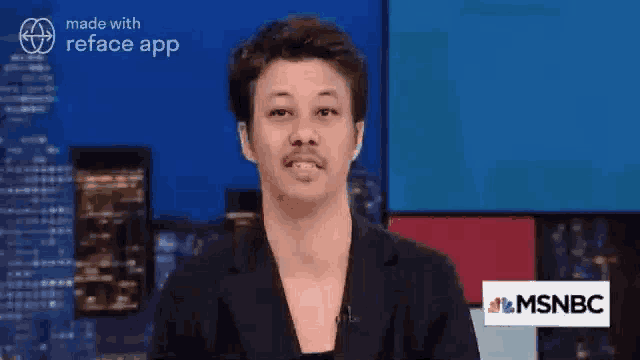 a man is standing in front of a msnbc logo on a television screen .