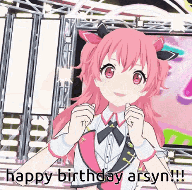a pink haired anime girl is standing on a stage with the words happy birthday asyn written below her .