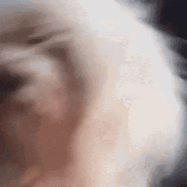 a close up of a dog 's face with smoke coming out of its nose