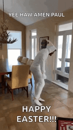 a man in a bunny costume is dancing in a living room .