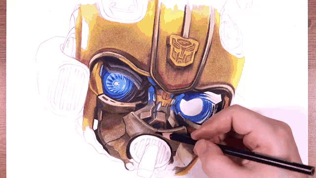 a person is drawing a robot head with a pencil