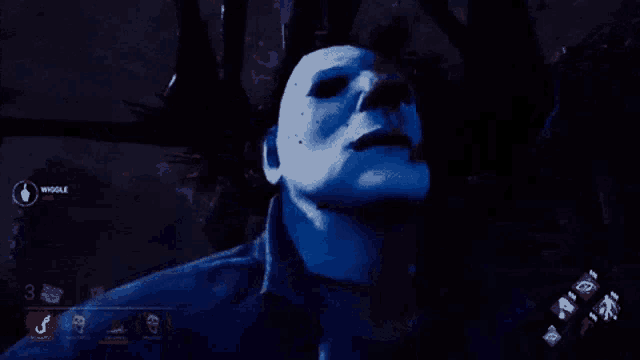 a man wearing a blue mask with blood on his face in a video game .