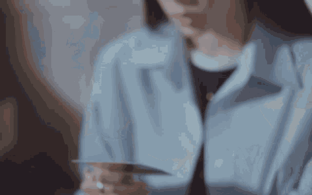 a close up of a woman 's face with closed eyes